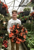 Bradley with a gorgeous begonia hanging basket. Bradley with a gorgeous begonia hanging basket.