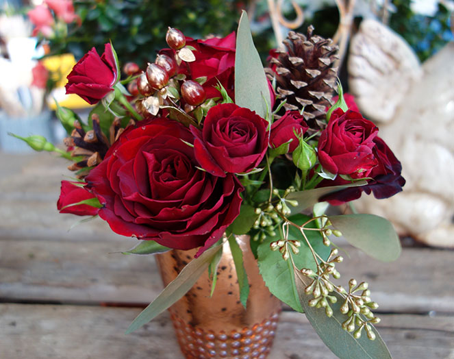 Red roses in a copper pot